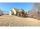 The house exterior features a covered deck and a large lawn at 103 Old Avery Dr, Canton, GA 30115