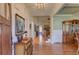 Grand foyer featuring hardwood floors, elegant lighting, and classic architectural details at 103 Old Avery Dr, Canton, GA 30115
