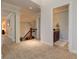 Upstairs hallway featuring plush carpeting, and views into other rooms at 103 Old Avery Dr, Canton, GA 30115