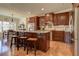 Spacious kitchen with granite countertops, stainless steel appliances, and hardwood floors at 103 Old Avery Dr, Canton, GA 30115