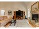 Open floorplan living room features fireplace, natural light, and hardwood flooring at 103 Old Avery Dr, Canton, GA 30115