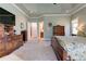Main bedroom with carpet, walk-in closet, ensuite bathroom, and a king bed at 103 Old Avery Dr, Canton, GA 30115