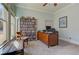 Home office featuring a large window, desk, and shelving at 103 Old Avery Dr, Canton, GA 30115