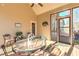 Relaxing screened porch with patio furniture and a peaceful outdoor setting at 103 Old Avery Dr, Canton, GA 30115