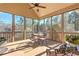 Enclosed screened porch with seating area and wooded views at 103 Old Avery Dr, Canton, GA 30115
