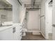 Modern bathroom with a subway-tiled shower, toilet, vanity with drawers and industrial-style exposed ductwork at 195 Arizona Ave # 179, Atlanta, GA 30307