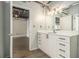 Bright bathroom featuring a modern vanity with drawers and an open doorway to another room at 195 Arizona Ave # 179, Atlanta, GA 30307