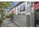 Contemporary townhome exterior with a private front patio, landscaping, and trees at 195 Arizona Ave # 179, Atlanta, GA 30307