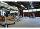 Large gym featuring exercise machines, free weights, exposed ductwork, and brick walls at 195 Arizona Ave # 179, Atlanta, GA 30307