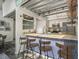 Modern kitchen with stainless steel appliances, granite counters, and eat-in bar with wood stools at 195 Arizona Ave # 179, Atlanta, GA 30307