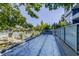 Community pool surrounded by landscaping and lounge chairs with partial glass enclosure at 195 Arizona Ave # 179, Atlanta, GA 30307