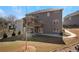 Backyard view of the house with a deck, patio, landscaped yard, and a walkway at 541 Glen Abbey Se Cir, Mableton, GA 30126