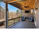 Outdoor deck with stone fireplace and television. Includes ceiling fan and lounge chairs for relaxing at 541 Glen Abbey Se Cir, Mableton, GA 30126