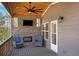 Outdoor deck with stone fireplace and television. Includes ceiling fan and lounge chairs for relaxing at 541 Glen Abbey Se Cir, Mableton, GA 30126
