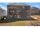 Exterior shot of the home with a deck, patio, and a well-maintained backyard, perfect for outdoor living at 541 Glen Abbey Se Cir, Mableton, GA 30126