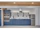 Close up of the kitchen featuring blue cabinets, stainless appliances, and modern fixtures at 541 Glen Abbey Se Cir, Mableton, GA 30126
