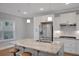 Modern kitchen features stainless steel appliances, granite counters, and a center island at 541 Glen Abbey Se Cir, Mableton, GA 30126