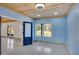 Light filled room with concrete floors, window, and doors to the outside at 541 Glen Abbey Se Cir, Mableton, GA 30126