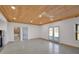 Open room with concrete floors and doors leading to the outside and a bathroom at 541 Glen Abbey Se Cir, Mableton, GA 30126