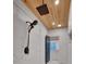 Modern shower with marble tile, rain shower head, and glass enclosure at 541 Glen Abbey Se Cir, Mableton, GA 30126