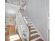 Bright foyer showcases a staircase with wood treads and white risers at 541 Glen Abbey Se Cir, Mableton, GA 30126