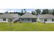 A spacious backyard with a well-manicured lawn offers a serene outdoor space for relaxation and recreation at 64 Lakeview Pt, Dallas, GA 30157