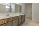 Bathroom with dual sink vanity with modern finishes, and tile flooring, adjacent to water closet at 64 Lakeview Pt, Dallas, GA 30157