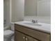 Bathroom featuring a vanity with ample storage, sink, toilet, and shower with tub at 64 Lakeview Pt, Dallas, GA 30157
