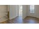 View of modern bathroom, neutral paint and wood floors, and a doorway to additional rooms at 64 Lakeview Pt, Dallas, GA 30157