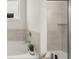 A well-lit bathroom showcasing a tub-shower combo at 64 Lakeview Pt, Dallas, GA 30157