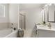 Bright bathroom featuring a shower, soaking tub, double sink vanity, and modern fixtures at 64 Lakeview Pt, Dallas, GA 30157
