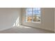 Bright bedroom with large window and neutral carpet, perfect for relaxation at 64 Lakeview Pt, Dallas, GA 30157