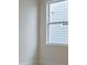 Bright bedroom featuring a window and white walls creating a clean and minimalist space at 64 Lakeview Pt, Dallas, GA 30157