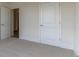 Cozy bedroom featuring plush carpet and white doors and trim creating a serene atmosphere at 64 Lakeview Pt, Dallas, GA 30157