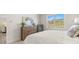 Serene bedroom featuring a dresser, natural light, and a comfortable bed at 64 Lakeview Pt, Dallas, GA 30157