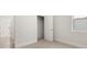 Bright bedroom featuring a door to a walk in closet at 64 Lakeview Pt, Dallas, GA 30157