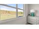 Scenic view from bedroom window, complemented by a decorative dresser and lamp at 64 Lakeview Pt, Dallas, GA 30157