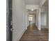 Inviting home entryway featuring hardwood floors and white trim leading to an open floor plan at 64 Lakeview Pt, Dallas, GA 30157