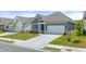 Beautiful one-story house featuring a well-kept lawn and a spacious two-car garage with a concrete driveway at 64 Lakeview Pt, Dallas, GA 30157