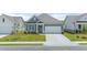 Charming one-story home featuring a well-manicured front lawn and a two-car garage with a concrete driveway at 64 Lakeview Pt, Dallas, GA 30157