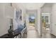 Welcoming foyer adorned with modern decor, seamlessly connects to other areas of the house, including dining at 64 Lakeview Pt, Dallas, GA 30157