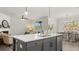 Open-concept kitchen and dining area with a large island, stainless steel appliances, and plenty of natural light at 64 Lakeview Pt, Dallas, GA 30157