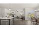 Open-concept living space with modern kitchen, cozy living room, and elegant dining area at 64 Lakeview Pt, Dallas, GA 30157