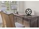 A well-lit office featuring a stylish desk and comfortable chairs at 64 Lakeview Pt, Dallas, GA 30157
