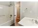 Bathroom featuring white cabinets and tub at 708 Wind Song Trce, Woodstock, GA 30189