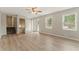 Bright living room featuring hardwood floors, large windows and neutral colors at 708 Wind Song Trce, Woodstock, GA 30189