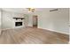 Spacious living room with stone fireplace and hardwood floors at 708 Wind Song Trce, Woodstock, GA 30189
