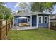 Fenced backyard with a patio, outdoor seating, and an umbrella at 1211 Mortimer Se Pl, Atlanta, GA 30317