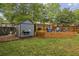 Cozy backyard shed with an adjacent seating area and lush greenery at 1211 Mortimer Se Pl, Atlanta, GA 30317