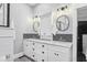 Bathroom featuring a double sink vanity with marble countertop and modern fixtures at 1211 Mortimer Se Pl, Atlanta, GA 30317